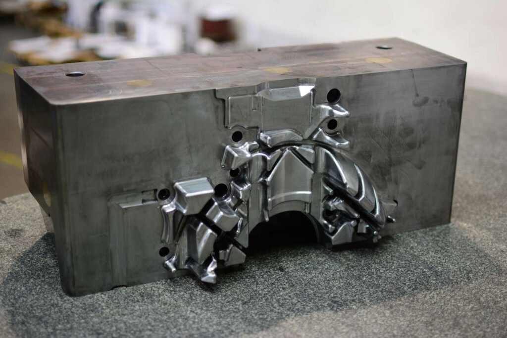 Mold base with complex cavity for automotive component shaping