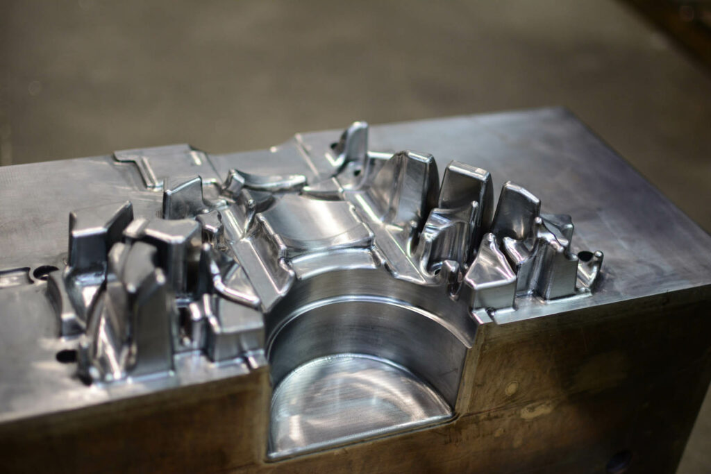 Detail of high-precision die casting mold used in automotive part production