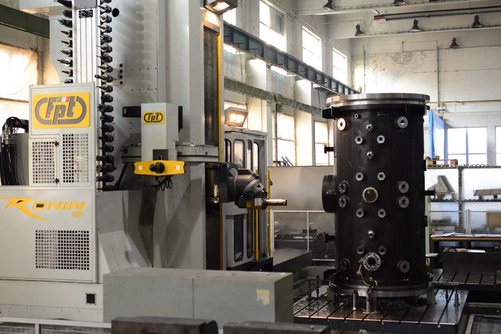 Vertical cylindrical welded workpiece being machined on FPT Ronin 300/400 horizontal CNC milling machine.