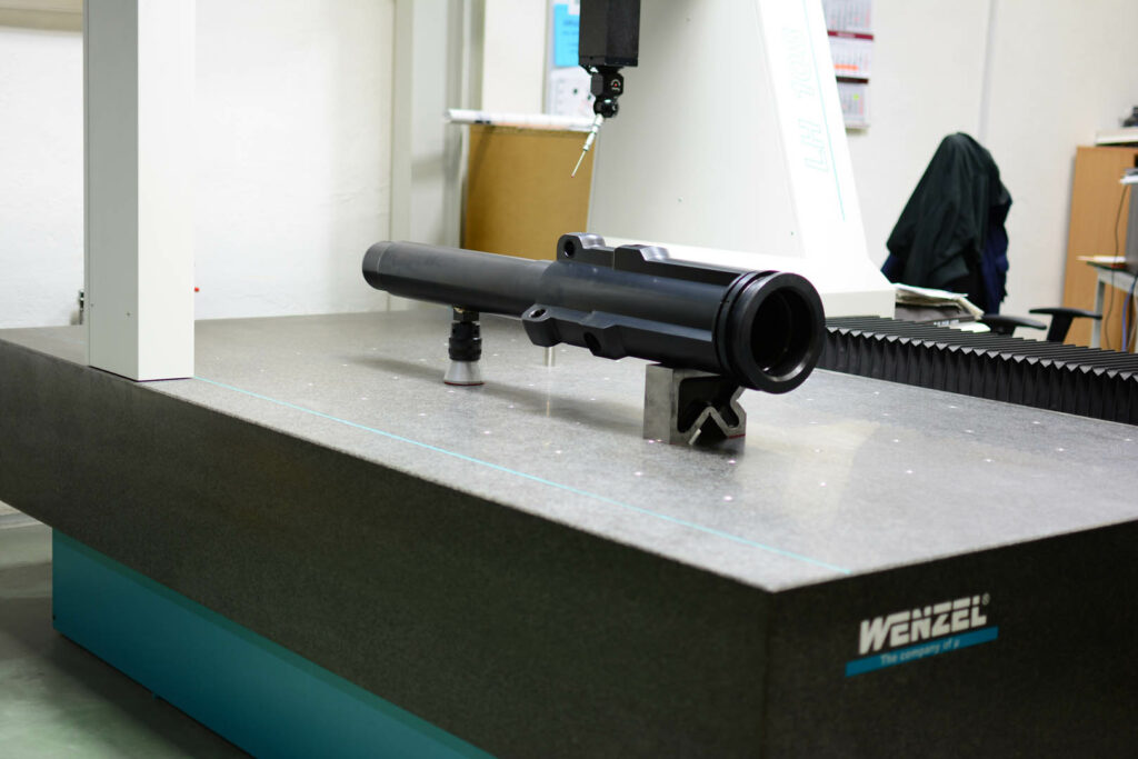 Black industrial cylinder on inspection stand, designed for oil and gas use