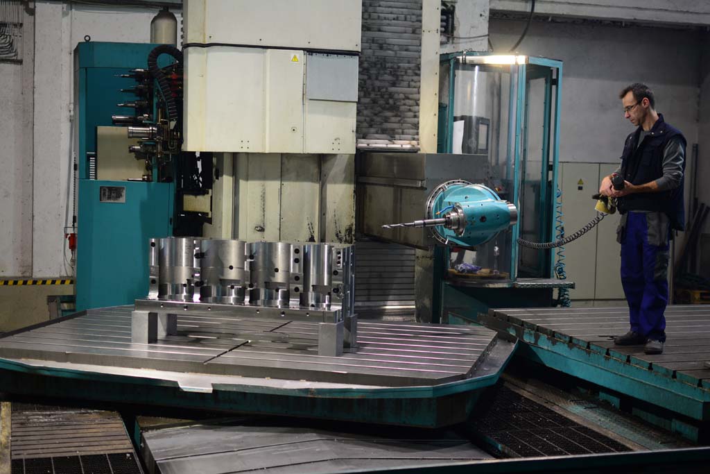 CNC operator working at TOS FUQ 150 horizontal milling machine